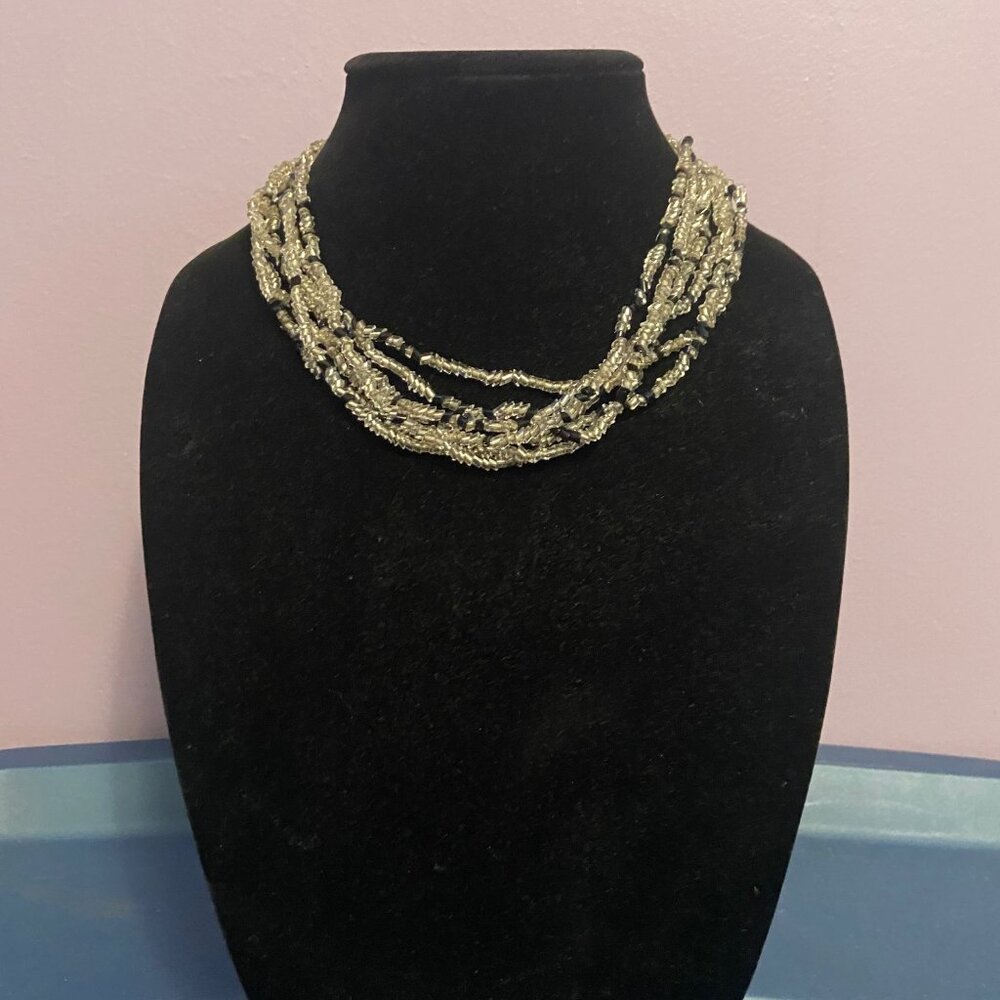 Multi-strand beaded necklace in clear and black
